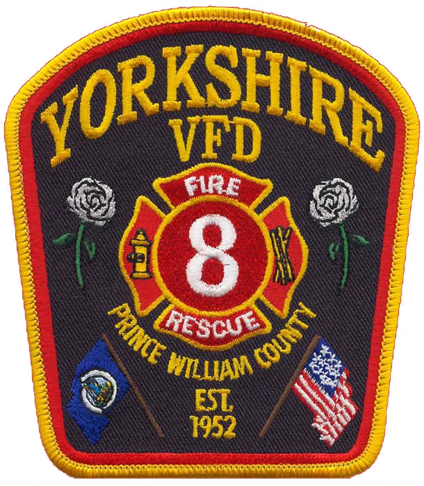 Yorkshire VFD patch with "8 Fire Rescue," two white roses, US and Virginia flags, "Prince William County," and "Est. 1952" on a dark background.